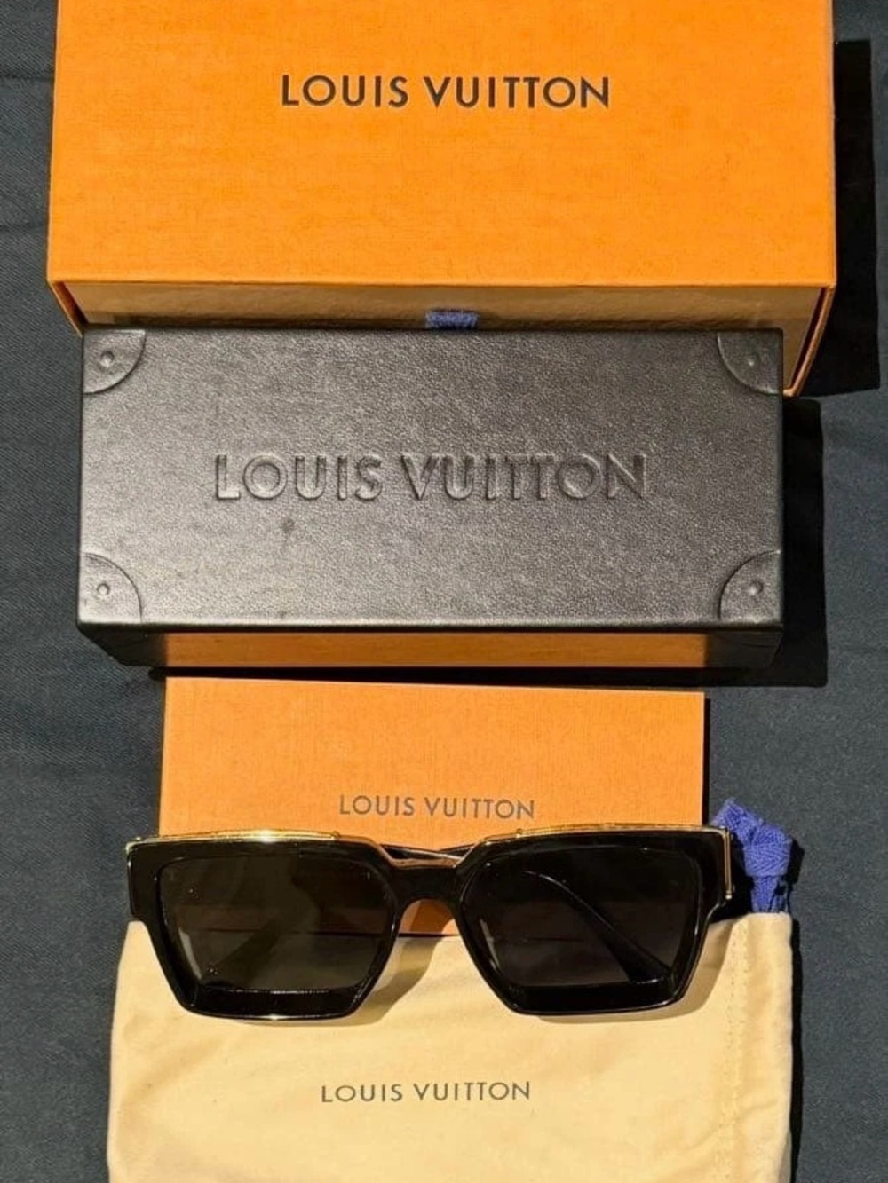 Louis Vuitton Black and Gold
Rectangle Sunglasses